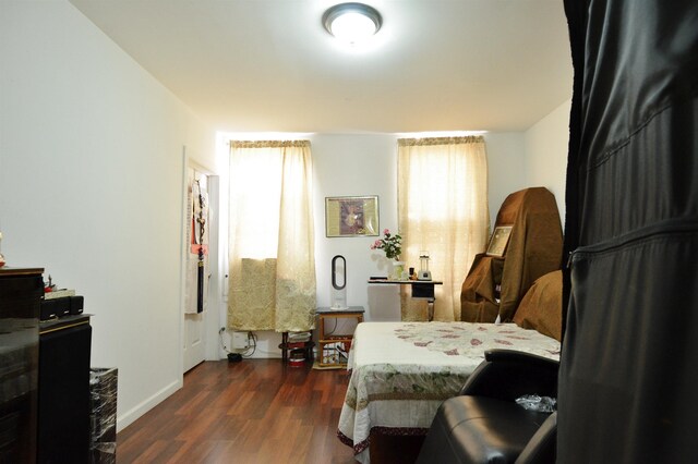 34 Concord St, Jersey City, NJ 07306 - bedroom featuring baseboards and dark wood finished floors