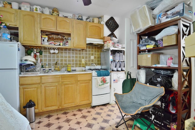 34 Concord St, Jersey City, NJ 07306 - kitchen with white appliances, light floors, under cabinet range hood, light countertops, and a sink
