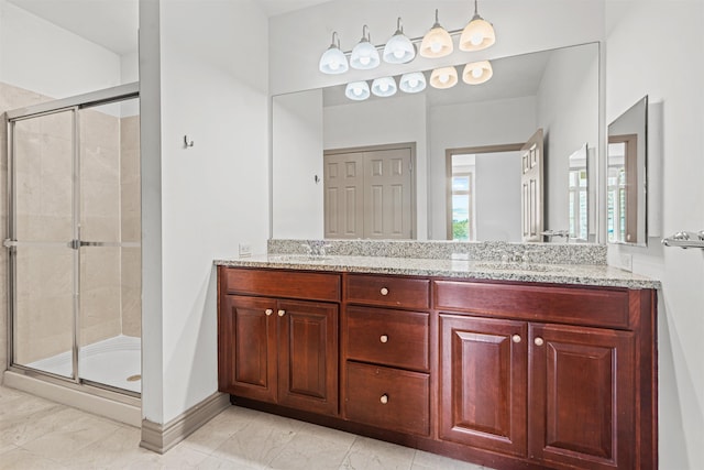 7400 River Rd Unit 304, North Bergen, NJ 07047 - bathroom with double vanity, a shower stall, baseboards, and marble finish floors