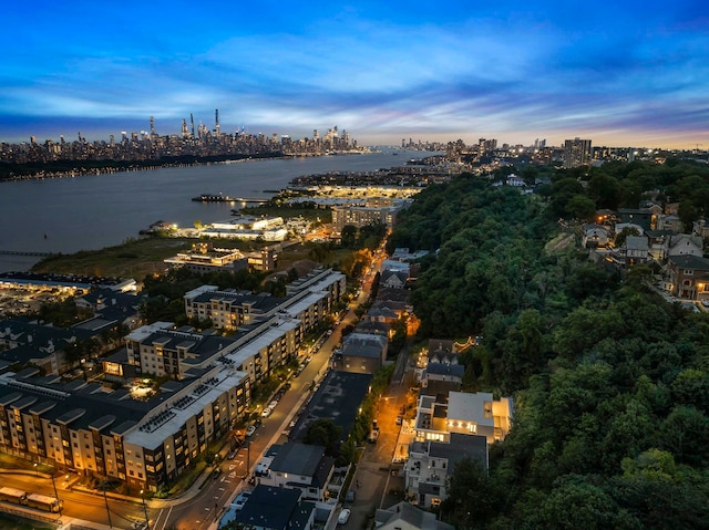 aerial view at dusk with a water view