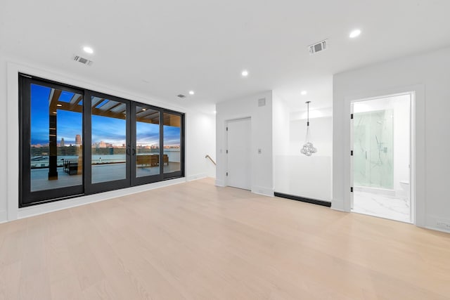 unfurnished room with light hardwood / wood-style floors