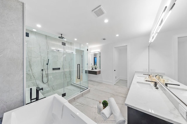 bathroom featuring shower with separate bathtub and vanity