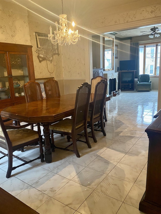 dining space with a chandelier and an AC wall unit