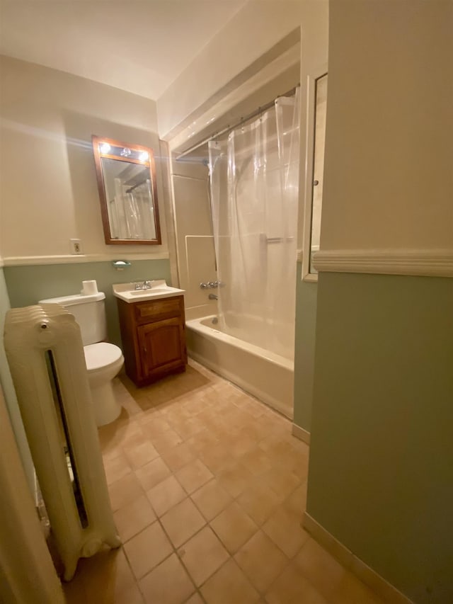 full bathroom with radiator, shower / tub combo, vanity, tile patterned floors, and toilet