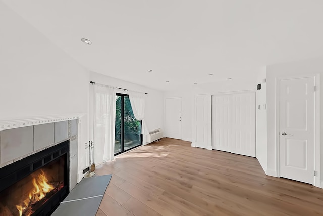 90 Ralph St Unit 3, Belleville, NJ 07109 - unfurnished living room featuring light wood-style floors, a fireplace, and recessed lighting