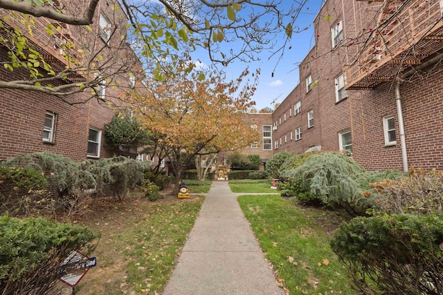 view of property's community with a yard