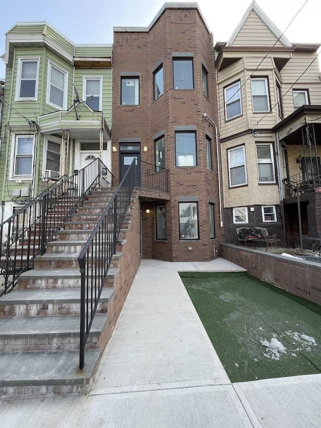 view of front of house featuring stairway