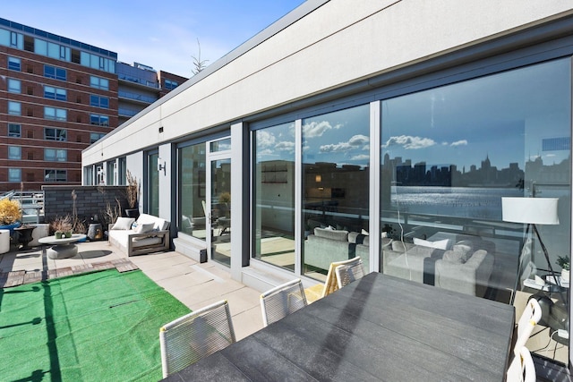 view of patio with a city view and outdoor dining space