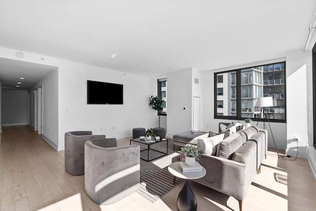 living area featuring wood finished floors and baseboards