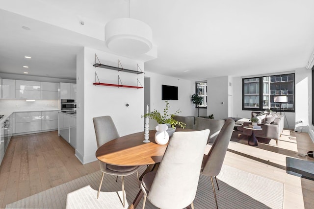 dining room featuring light wood-style floors and recessed lighting