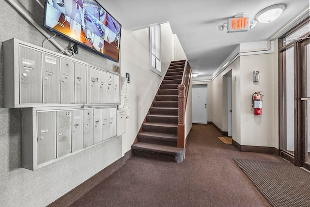 stairs featuring carpet flooring, mail boxes, and crown molding