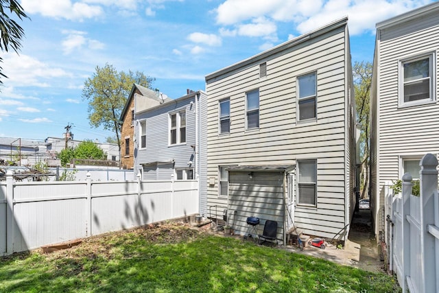 57 Booraem Ave, Jersey City, NJ 07307 - rear view of property featuring a fenced backyard