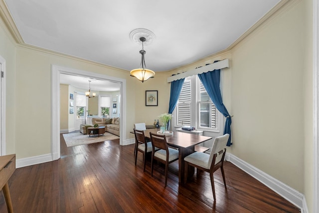 57 Booraem Ave, Jersey City, NJ 07307 - dining room with crown molding, dark wood-type flooring, and a chandelier