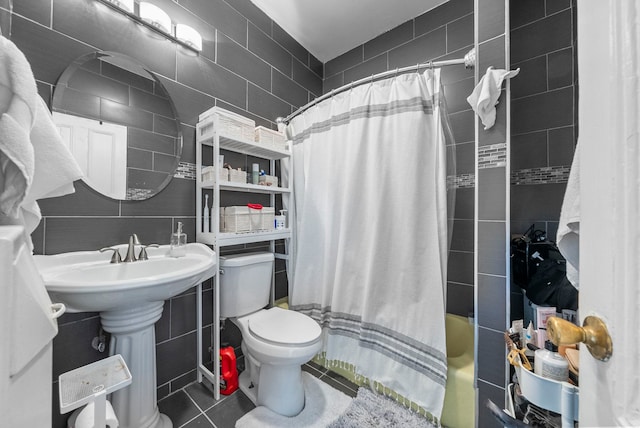 57 Booraem Ave, Jersey City, NJ 07307 - bathroom with tile walls, shower / tub combo with curtain, and tile patterned floors