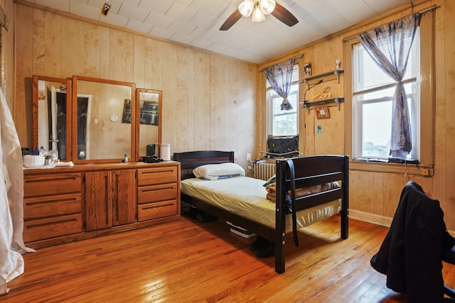 442 Avenue E Ave E, Bayonne, NJ 07002 - bedroom featuring wooden walls and light wood-style floors