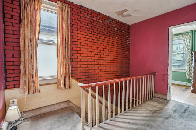 442 Avenue E Ave E, Bayonne, NJ 07002 - stairs featuring carpet, brick wall, and baseboards