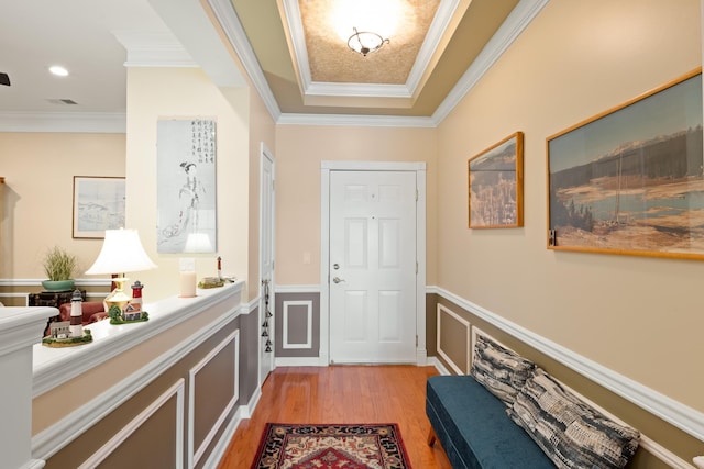 doorway to outside featuring recessed lighting, light wood-type flooring, visible vents, and crown molding