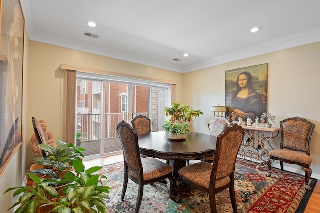 dining room featuring ornamental molding, recessed lighting, and visible vents