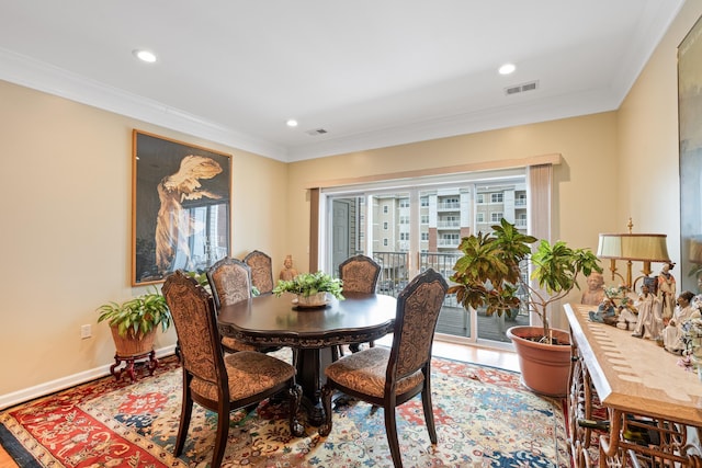 dining space with recessed lighting, baseboards, visible vents, and ornamental molding