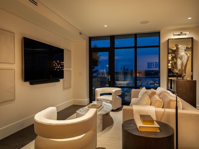 living room with hardwood / wood-style floors and floor to ceiling windows