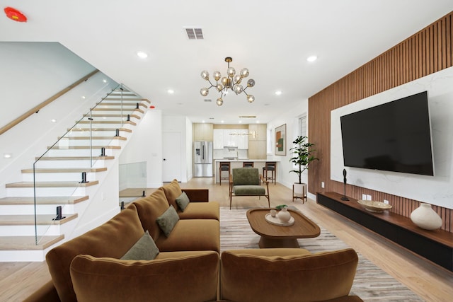 9 Pierce Ave Unit 2, Jersey City, NJ 07307 - living room featuring stairway, light wood-type flooring, a chandelier, and recessed lighting