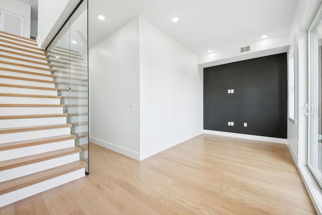 9 Pierce Ave Unit 2, Jersey City, NJ 07307 - spare room with stairway, light wood finished floors, and recessed lighting