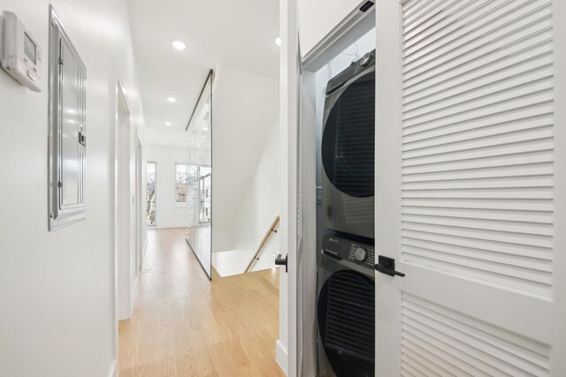 9 Pierce Ave Unit 2, Jersey City, NJ 07307 - hallway with estacked washer and dryer, an upstairs landing, light wood-type flooring, and recessed lighting