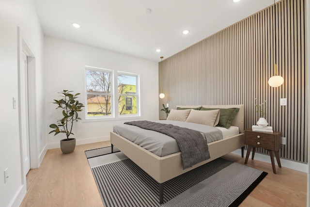 9 Pierce Ave Unit 2, Jersey City, NJ 07307 - bedroom featuring light wood-type flooring, recessed lighting, and an accent wall
