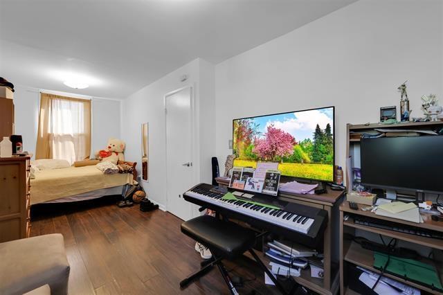bedroom featuring wood finished floors