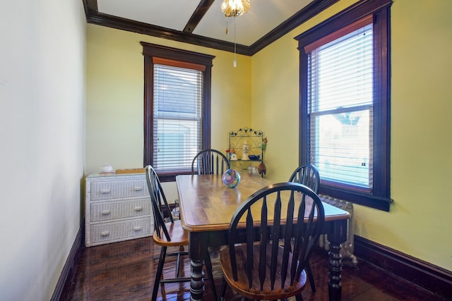 dining room with dark hardwood / wood-style flooring and ornamental molding