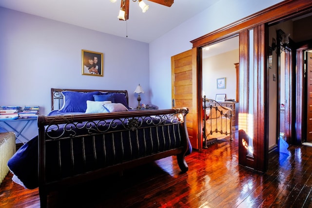 bedroom featuring hardwood / wood-style flooring and ceiling fan