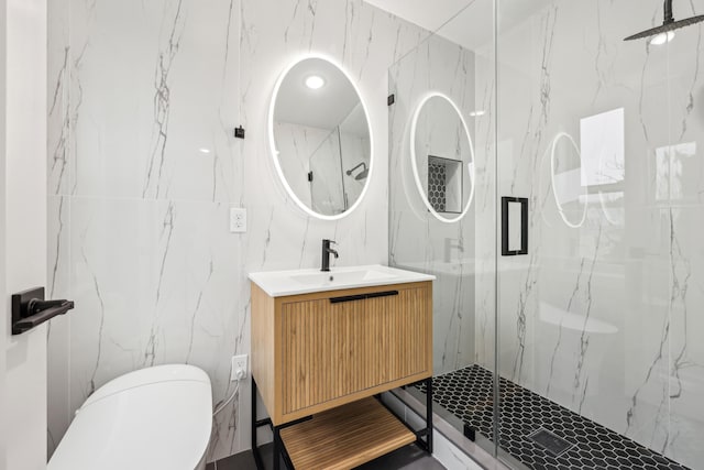 27 E 16th St, Bayonne, NJ 07002 - bathroom with tile walls, a marble finish shower, vanity, and toilet