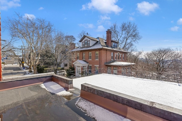 6 Kingswood Rd, Weehawken, NJ 07086 - snow covered property with brick siding and a chimney