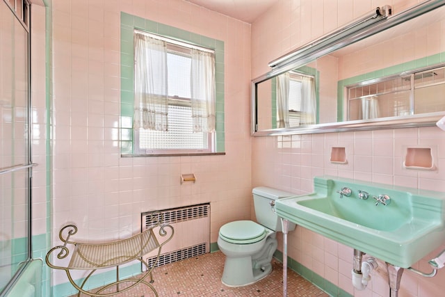 6 Kingswood Rd, Weehawken, NJ 07086 - full bathroom featuring radiator, toilet, tile walls, a sink, and tile patterned floors