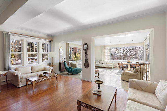 6 Kingswood Rd, Weehawken, NJ 07086 - living room with crown molding, wood finished floors, and a baseboard heating unit