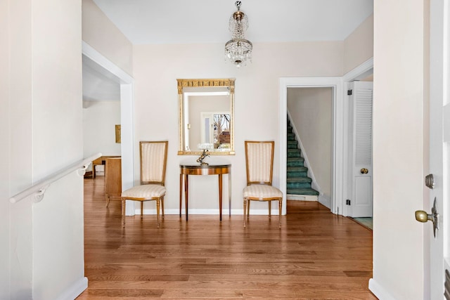 6 Kingswood Rd, Weehawken, NJ 07086 - hallway featuring light wood-type flooring, stairs, and a chandelier