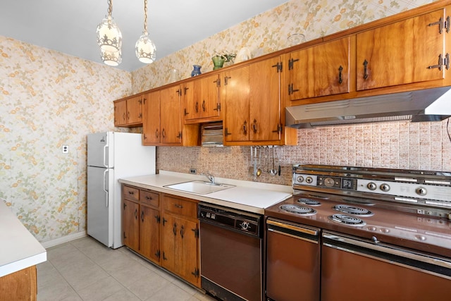 6 Kingswood Rd, Weehawken, NJ 07086 - kitchen with electric range oven, black dishwasher, under cabinet range hood, a sink, and wallpapered walls