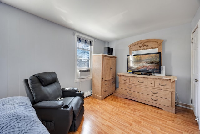 sitting room with light wood-style floors and a baseboard radiator