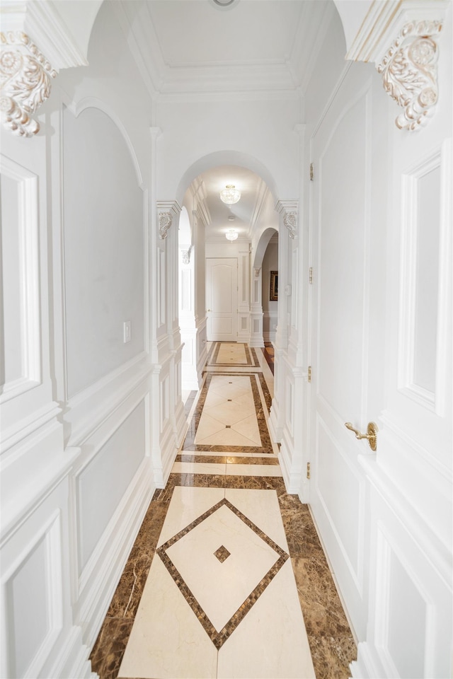 2 Euclid Rd, Fort Lee, NJ 07024 - corridor featuring arched walkways, crown molding, a decorative wall, ornate columns, and inlaid floor details