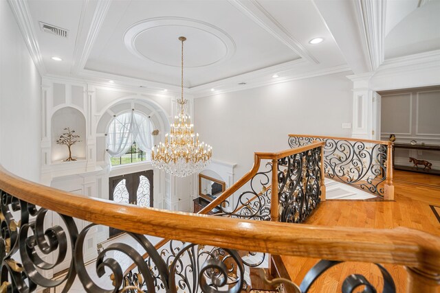 2 Euclid Rd, Fort Lee, NJ 07024 - stairs with wood finished floors, ornamental molding, a chandelier, and ornate columns