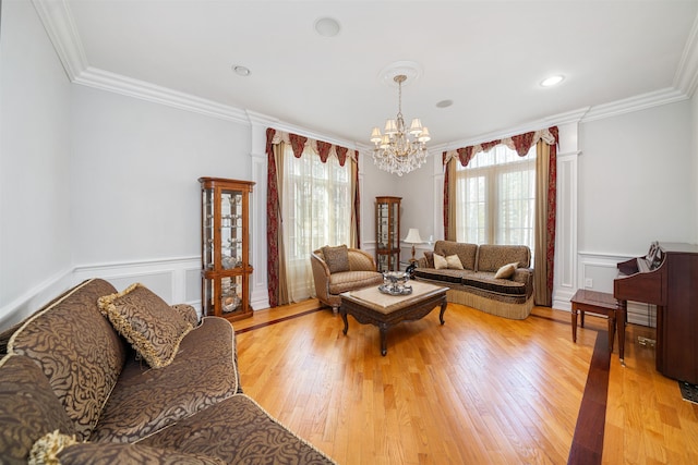 2 Euclid Rd, Fort Lee, NJ 07024 - living room featuring a chandelier, crown molding, light wood-style floors, wainscoting, and a decorative wall
