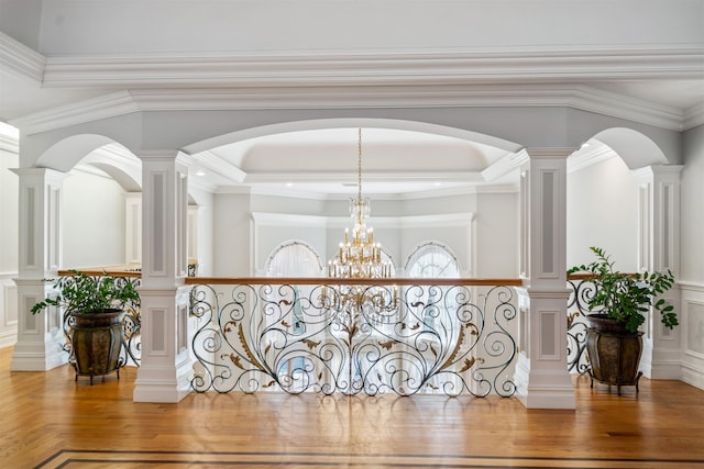 2 Euclid Rd, Fort Lee, NJ 07024 - hallway with wood finished floors, ornamental molding, a decorative wall, wainscoting, and arched walkways