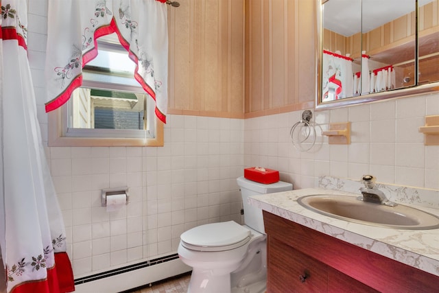 134 W 25th St, Bayonne, NJ 07002 - full bathroom with a baseboard radiator, wallpapered walls, toilet, tile walls, and vanity