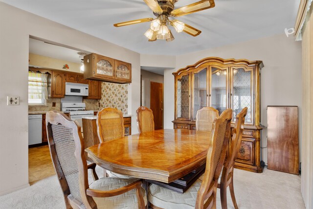 134 W 25th St, Bayonne, NJ 07002 - dining space featuring light colored carpet and ceiling fan