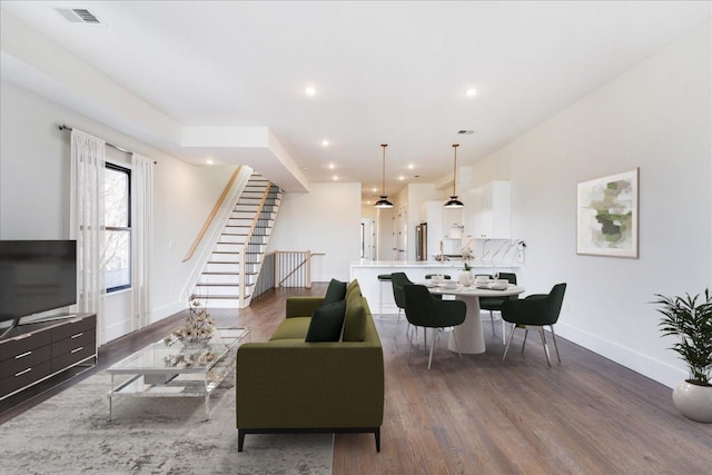 living room featuring dark hardwood / wood-style flooring