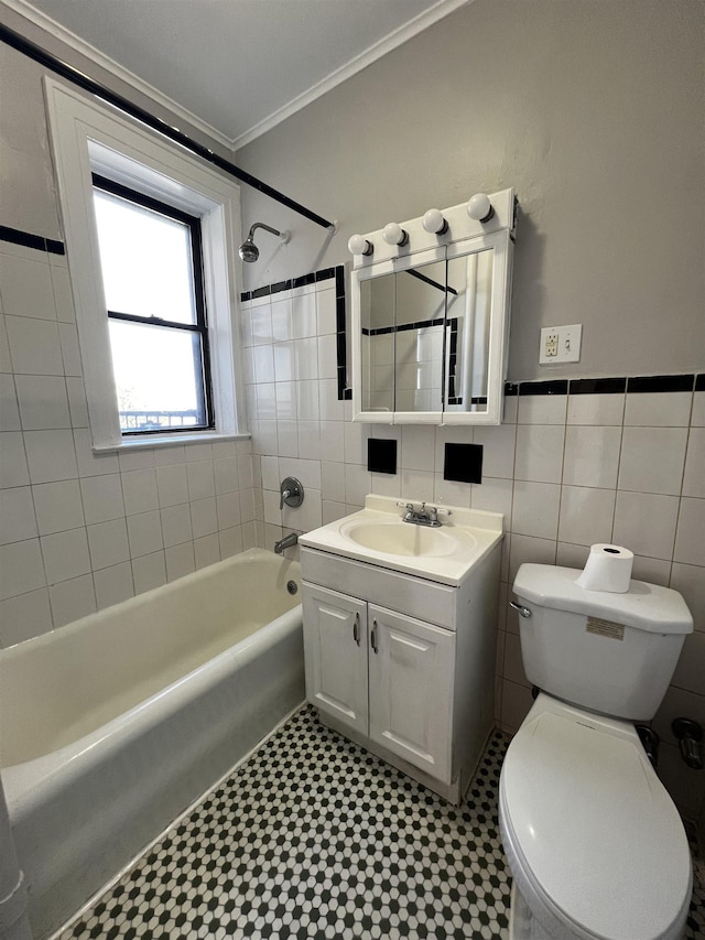 901 Grand Ave Unit B5, North Bergen, NJ 07047 - bathroom featuring shower / bathtub combination, vanity, toilet, tile walls, and ornamental molding