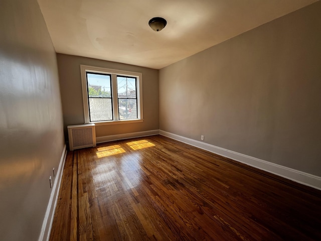 901 Grand Ave Unit B5, North Bergen, NJ 07047 - spare room with radiator, baseboards, and dark wood-style flooring