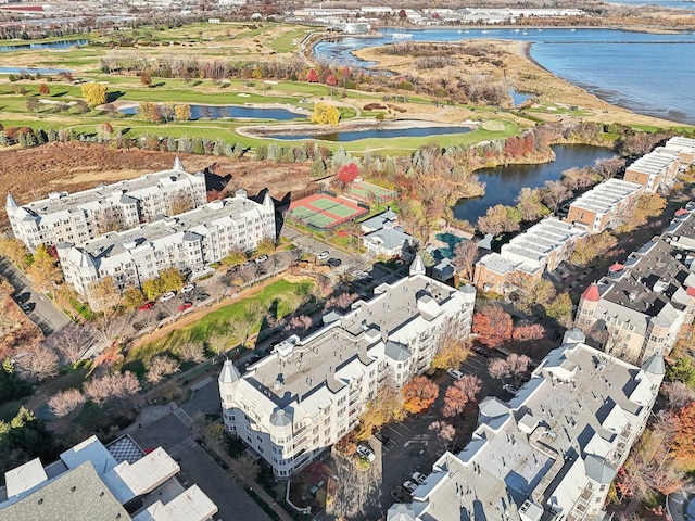 birds eye view of property featuring golf course view and a water view