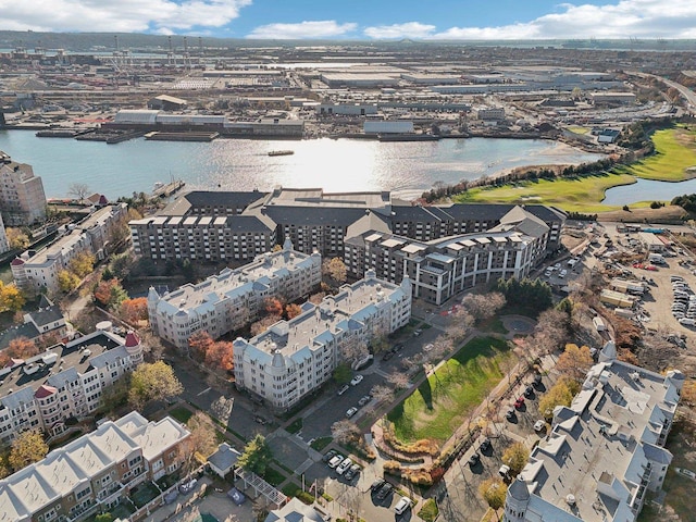 drone / aerial view with a view of city and a water view