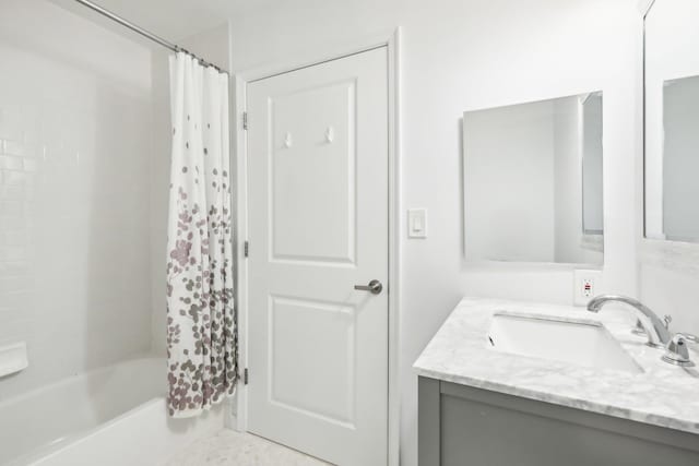 full bathroom with shower / bath combo with shower curtain and vanity